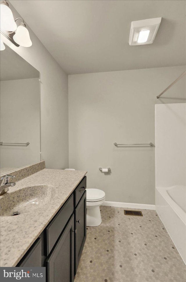 full bath featuring baseboards, visible vents, toilet, tile patterned floors, and vanity