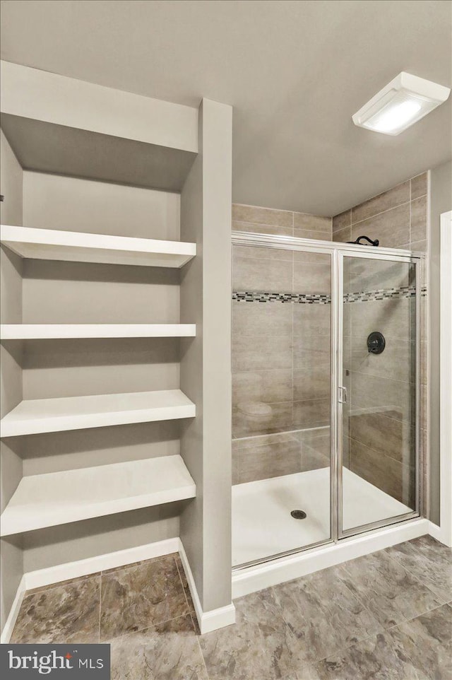 full bathroom featuring a stall shower