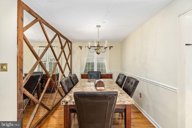 6510 Oakwood Dr, Falls Church, VA 22041 - dining area with an inviting chandelier, baseboards, and wood finished floors