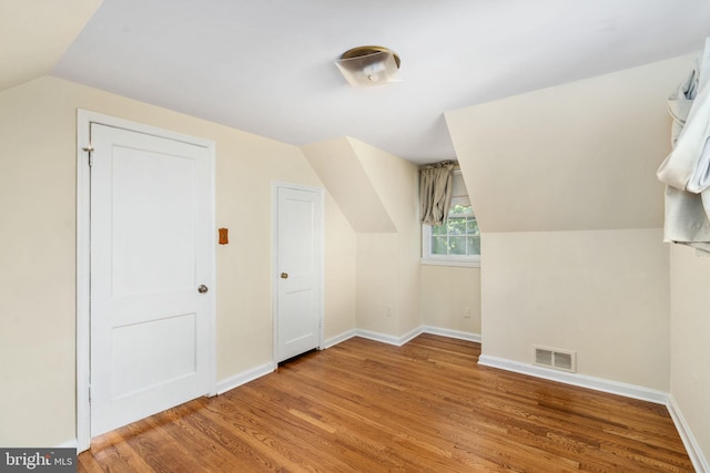 6510 Oakwood Dr, Falls Church, VA 22041 - bonus room with vaulted ceiling, baseboards, light wood-type flooring, and visible vents