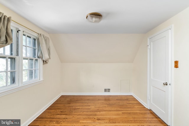 6510 Oakwood Dr, Falls Church, VA 22041 - additional living space with lofted ceiling, light wood-style floors, visible vents, and baseboards