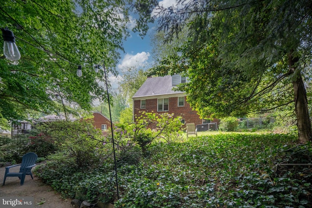 6510 Oakwood Dr, Falls Church, VA 22041 - rear view of house with brick siding and fence