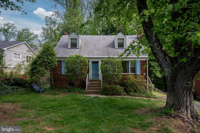 6510 Oakwood Dr, Falls Church, VA 22041 - new england style home featuring fence, a chimney, brick siding, and a front yard