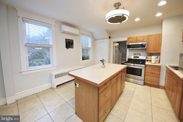 kitchen with radiator, light countertops, a kitchen island, gas range, and a wall mounted air conditioner