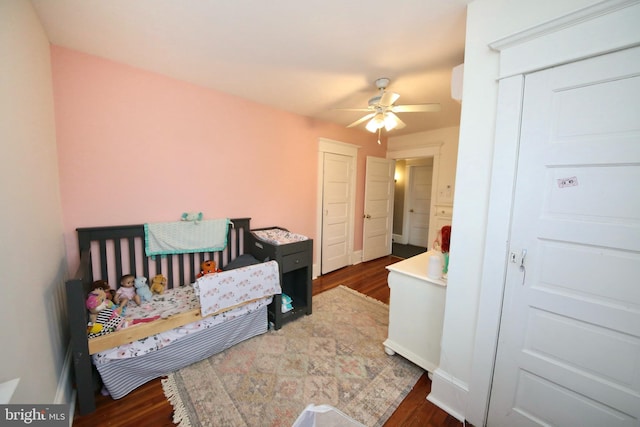 bedroom with dark wood-type flooring