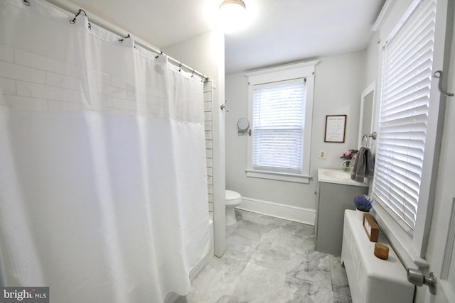 full bath with marble finish floor, baseboards, vanity, and toilet