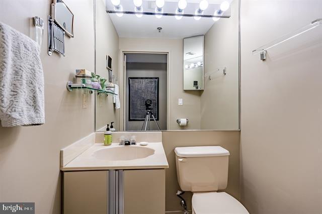 bathroom featuring vanity and toilet