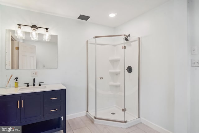 bathroom with vanity and walk in shower