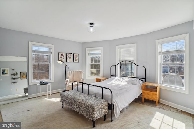 bedroom with multiple windows