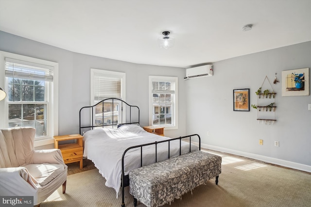 bedroom featuring a wall unit AC and wood-type flooring