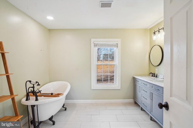 bathroom featuring a tub and vanity