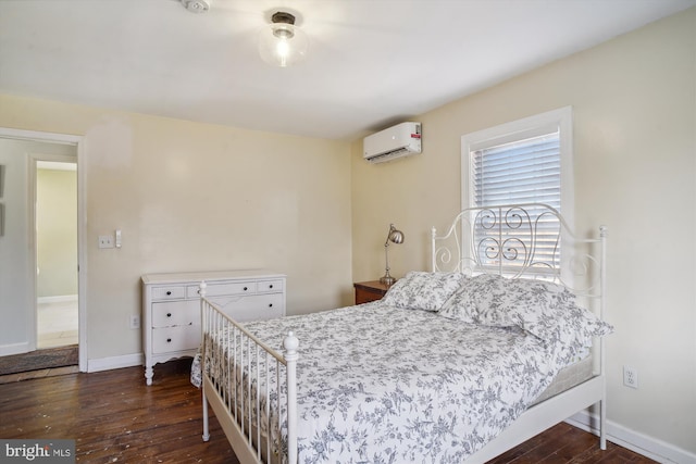 bedroom featuring dark wood-type flooring and an AC wall unit