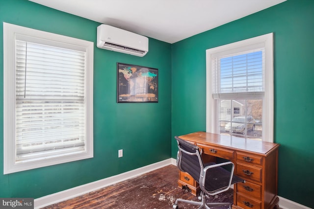 office space with a wall mounted air conditioner, dark hardwood / wood-style flooring, and a healthy amount of sunlight