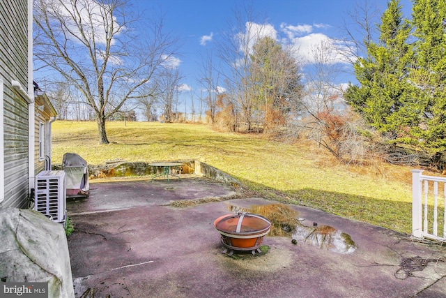 view of patio / terrace with an outdoor fire pit