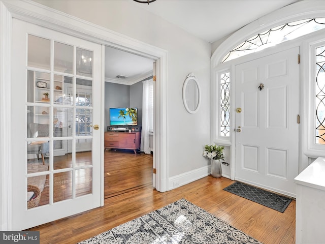 foyer entrance with hardwood / wood-style floors