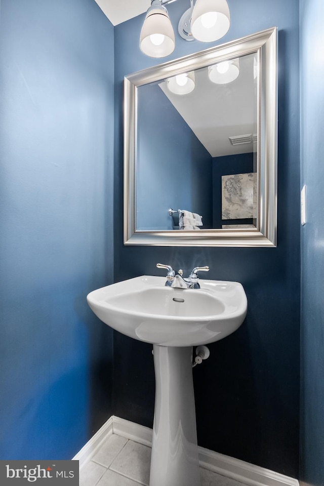 bathroom with tile patterned flooring, baseboards, and visible vents