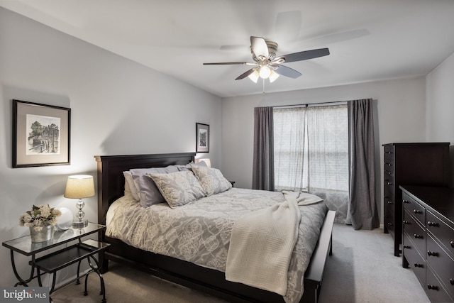 bedroom with light colored carpet and ceiling fan