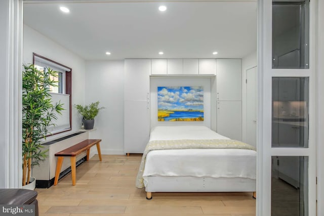 bedroom featuring recessed lighting, light wood-style flooring, and baseboards