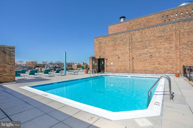 community pool featuring a patio area