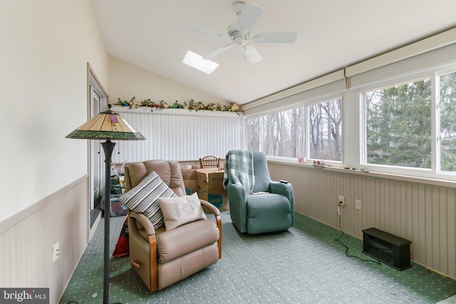 sunroom featuring vaulted ceiling with skylight and ceiling fan