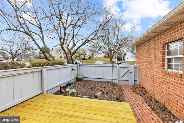 deck featuring a gate and fence