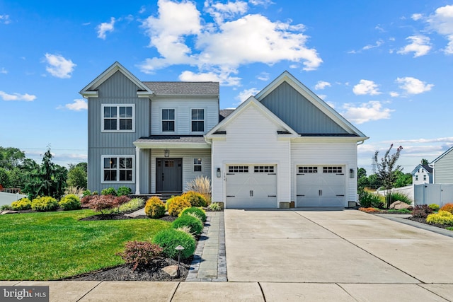 view of front of home with a front lawn and a garage