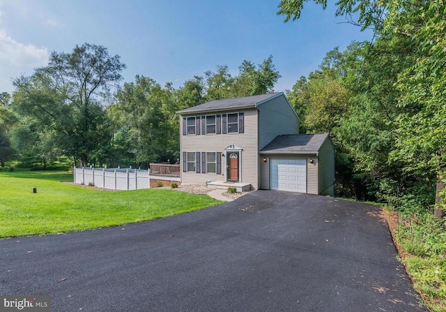 view of front of home featuring a garage and a front yard