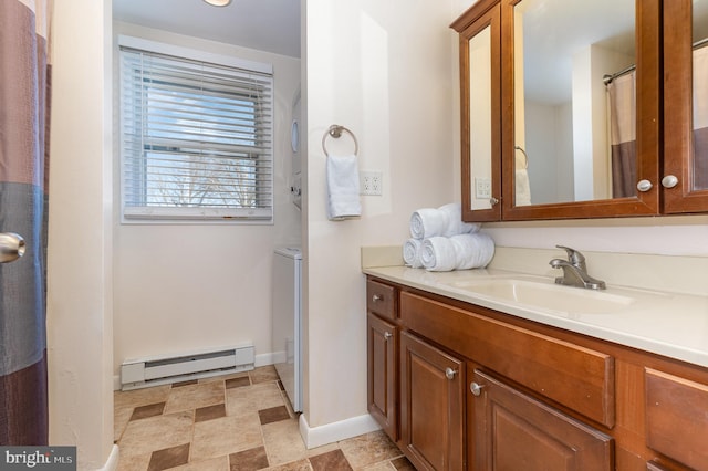 bathroom with a baseboard heating unit and vanity