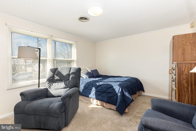 carpeted bedroom with ornamental molding