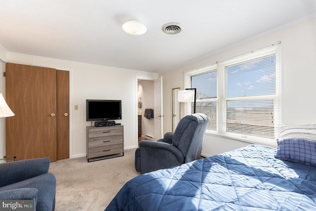 bedroom featuring light colored carpet and baseboard heating