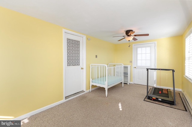 unfurnished bedroom with ceiling fan and carpet