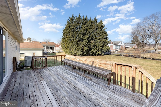 wooden deck with a yard