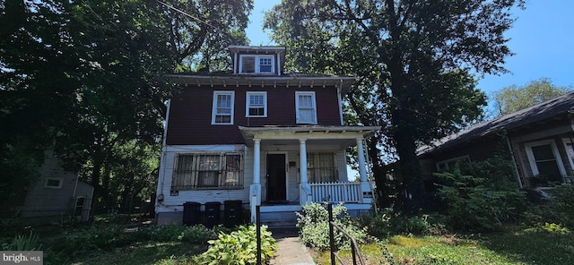 italianate-style house with covered porch