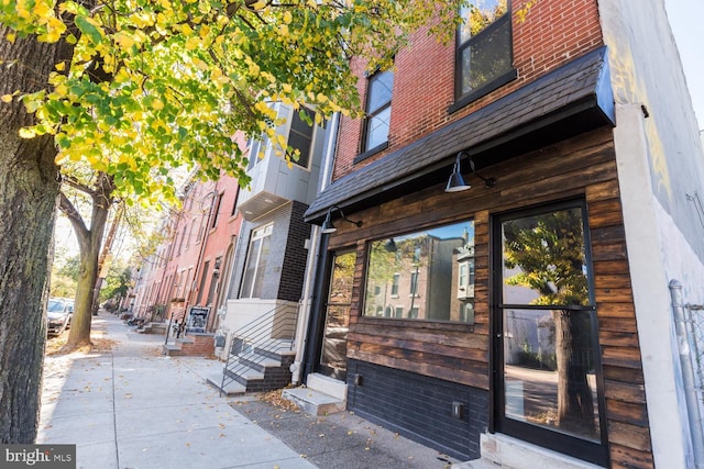 entrance to property with brick siding