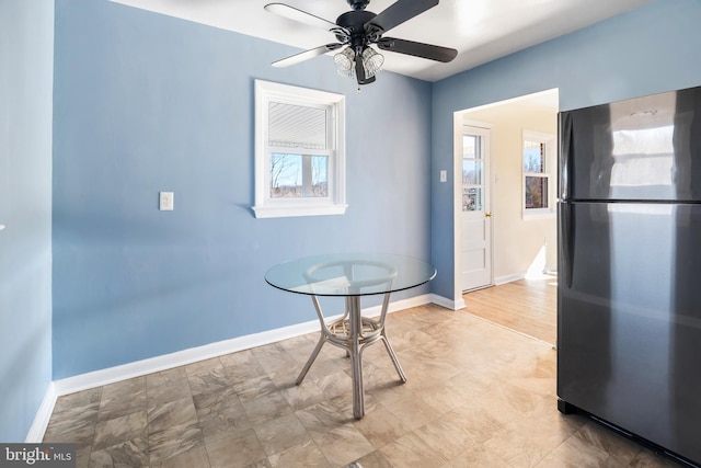 unfurnished dining area with ceiling fan