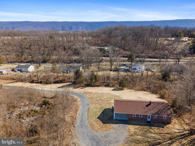 birds eye view of property featuring a mountain view