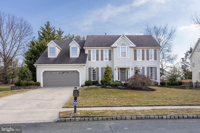 colonial-style house featuring a garage, driveway, a shingled roof, and a front lawn