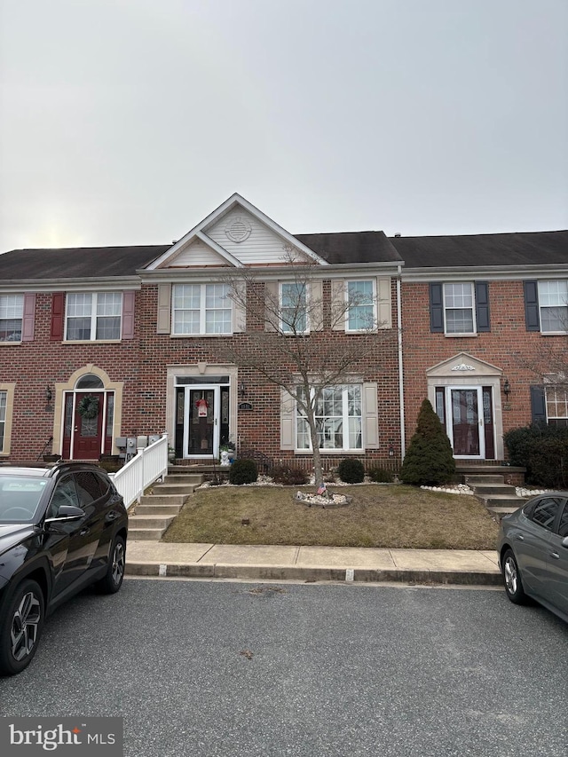 view of property with brick siding