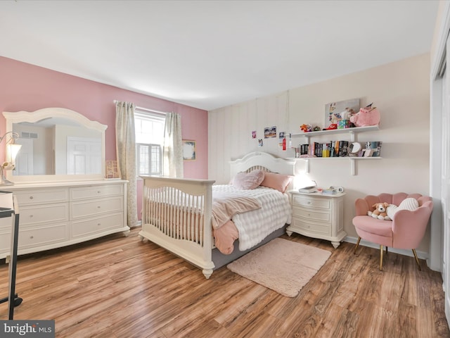 bedroom with light wood-style floors