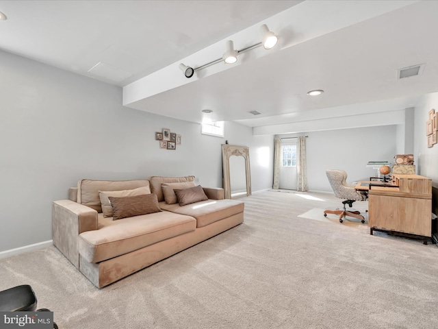 living room featuring baseboards, visible vents, and carpet flooring