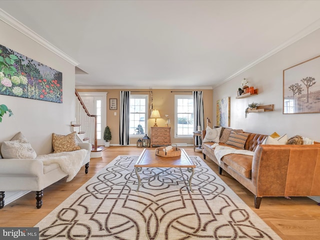 living room featuring ornamental molding, stairway, and wood finished floors