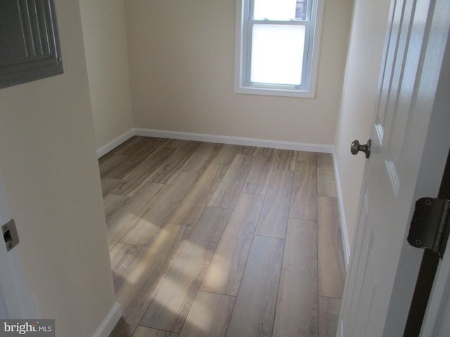 unfurnished room featuring light wood-type flooring