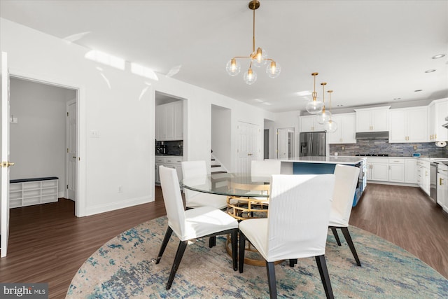 dining area with dark hardwood / wood-style floors