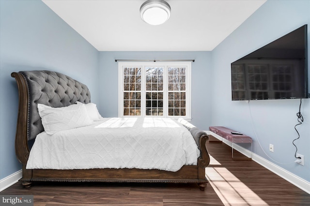 bedroom with wood-type flooring