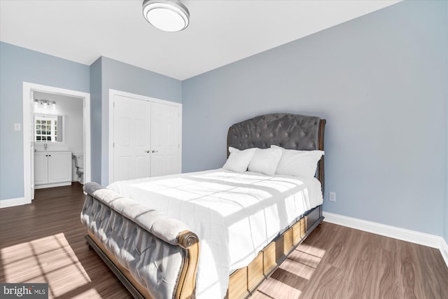 bedroom featuring a closet and dark hardwood / wood-style floors