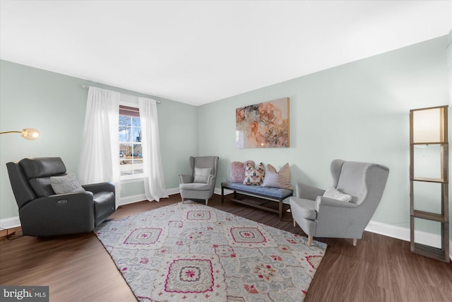 living area with hardwood / wood-style flooring