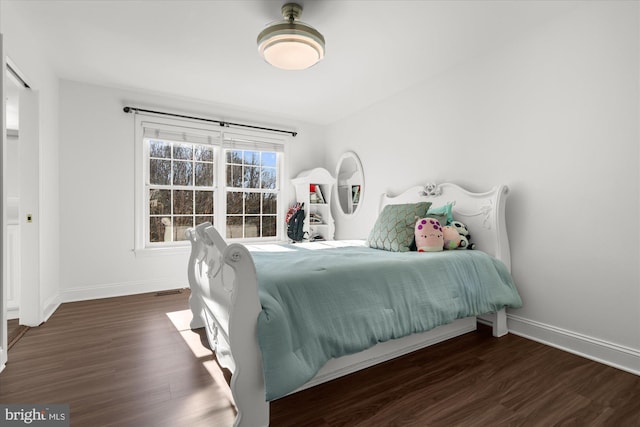 bedroom featuring dark hardwood / wood-style floors