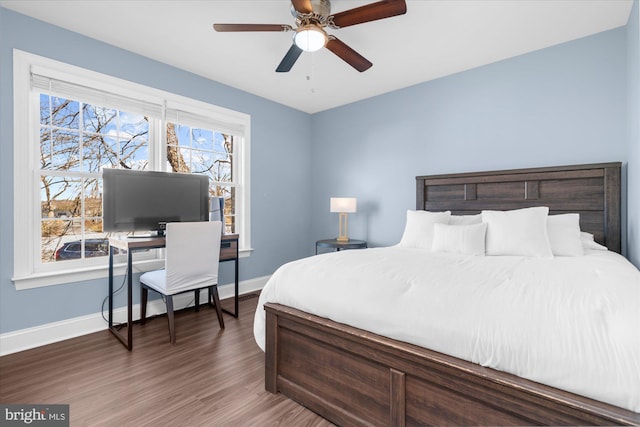 bedroom with dark wood-type flooring and ceiling fan