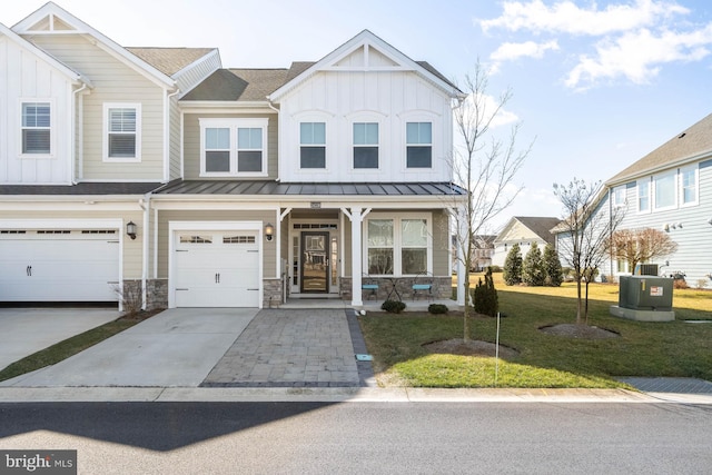 view of front of property featuring a garage and a front yard