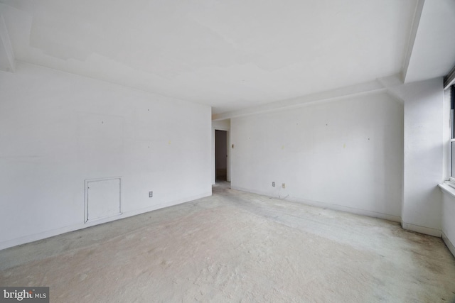 empty room with baseboards